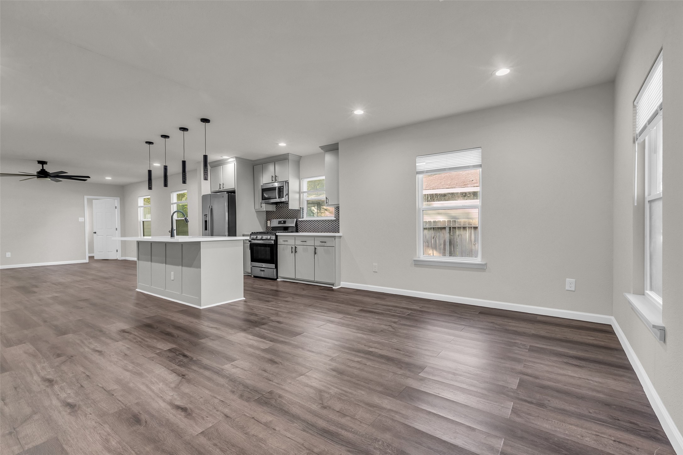 116 Gans Street Houston, TX 77029 - Photo 16 of 25 a view of kitchen with kitchen island wooden floors appliances and cabinets