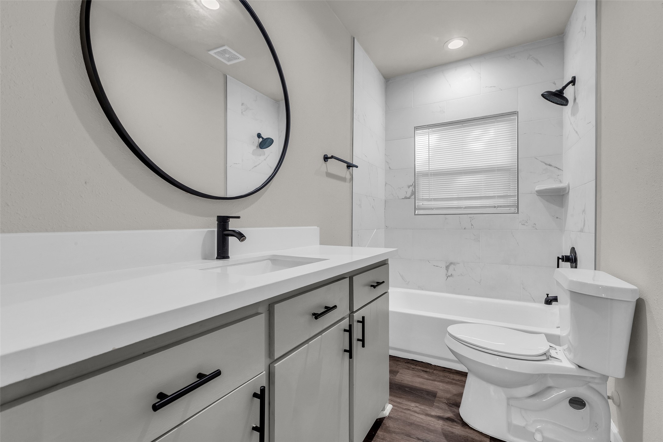 116 Gans Street Houston, TX 77029 - Photo 18 of 25 a bathroom with a sink a toilet and a mirror