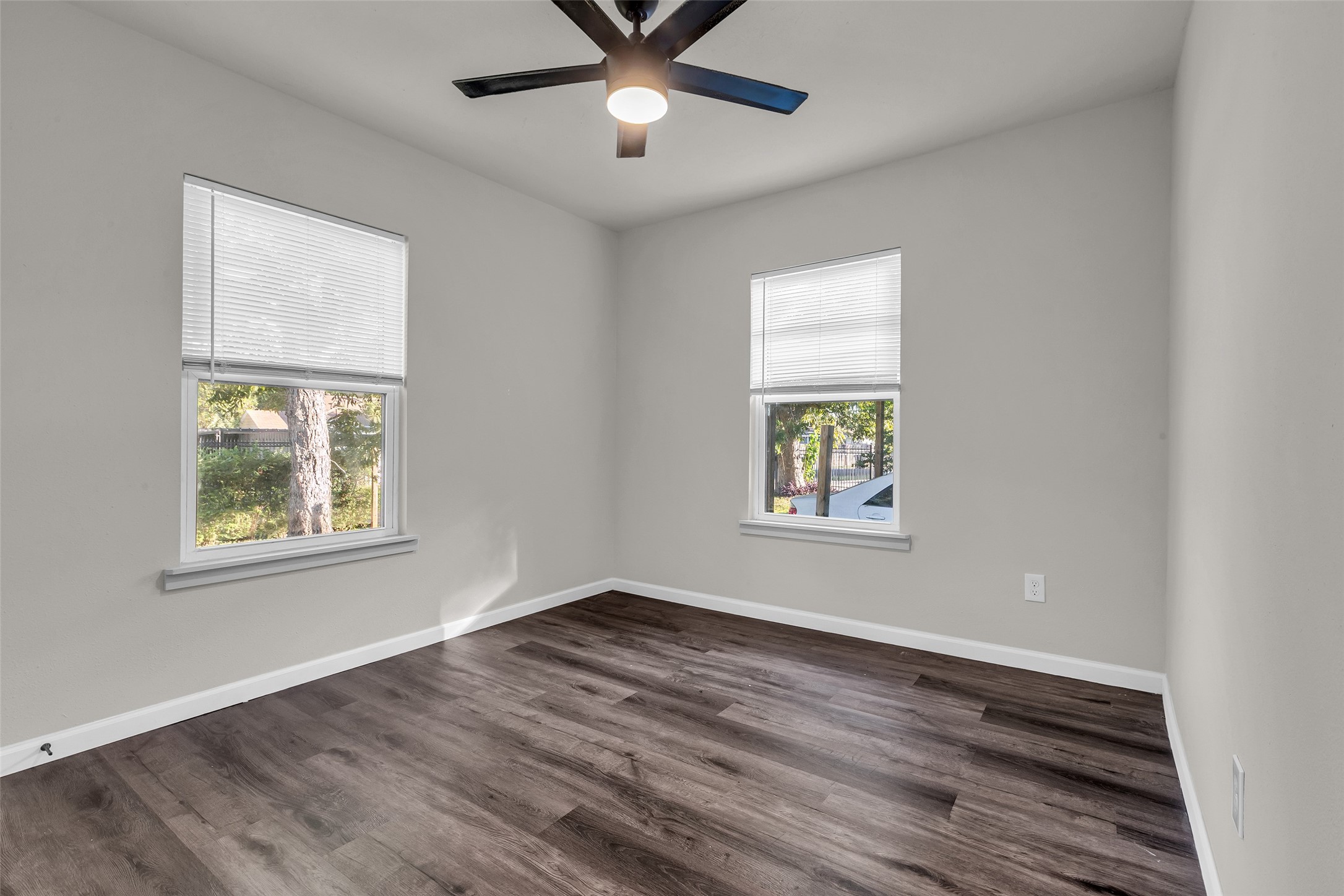 116 Gans Street Houston, TX 77029 - Photo 19 of 25 a view of an empty room with wooden floor and a window