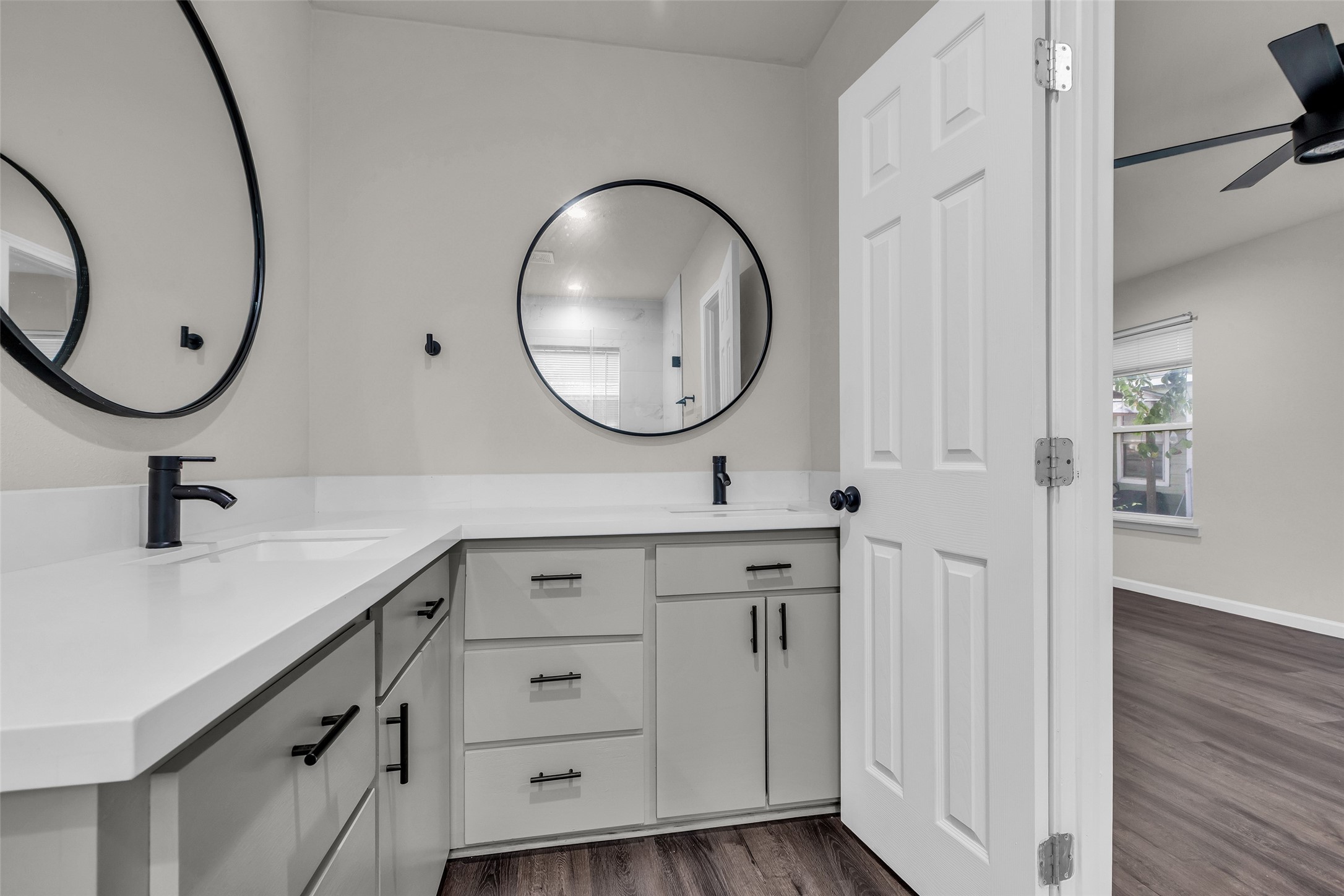 116 Gans Street Houston, TX 77029 - Photo 22 of 25 a bathroom with a double vanity sink and a mirror