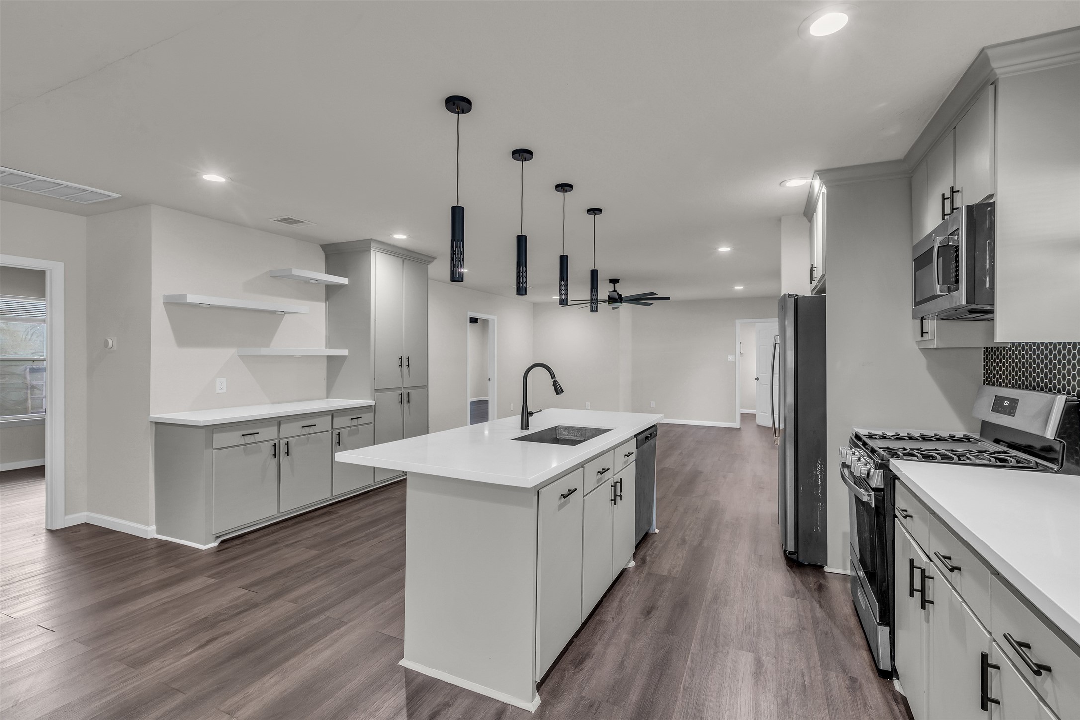 116 Gans Street Houston, TX 77029 - Photo 7 of 25 a kitchen with a sink stove and cabinets