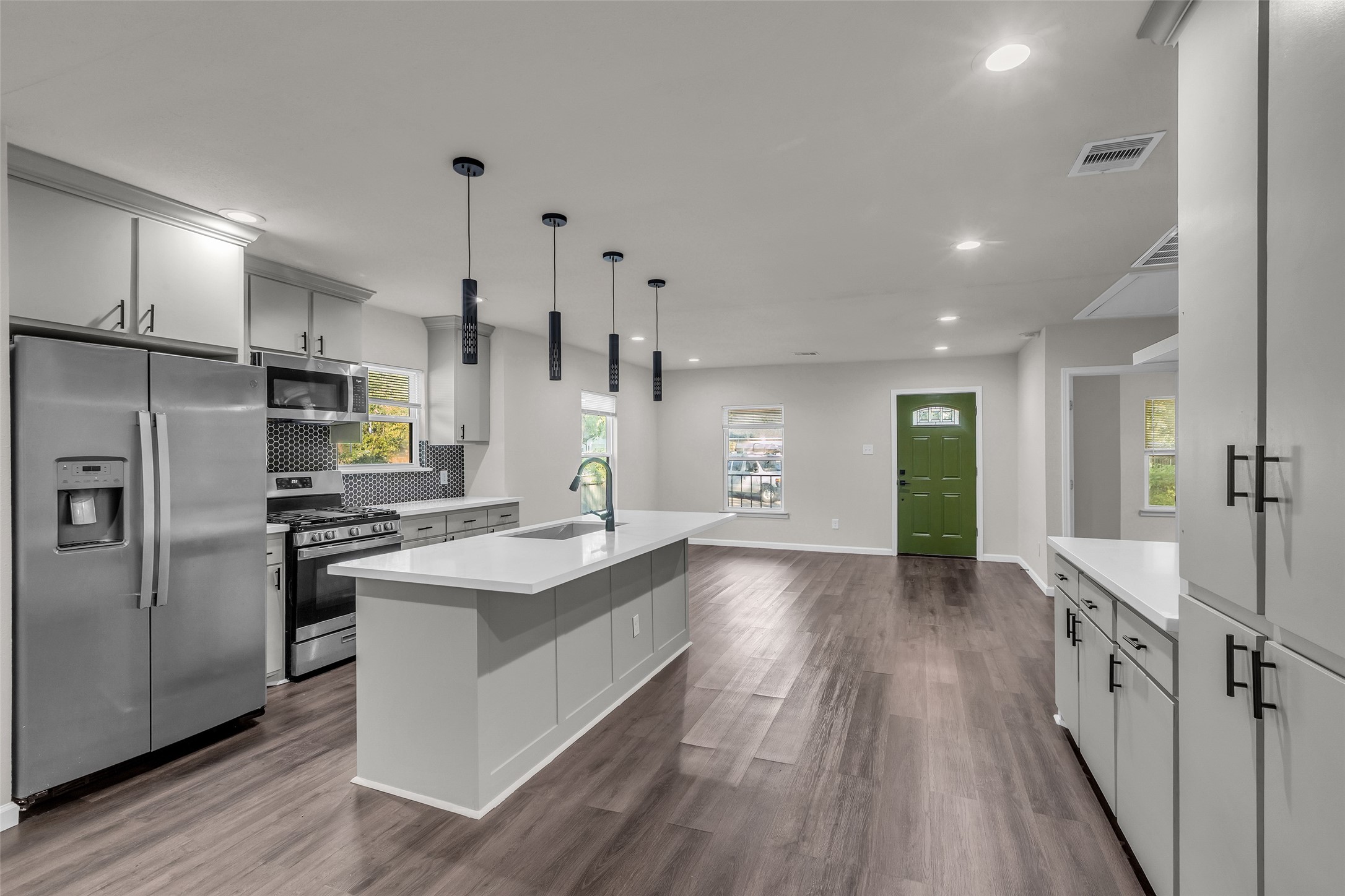 116 Gans Street Houston, TX 77029 - Photo 8 of 25 a kitchen with stainless steel appliances granite countertop a sink stove and refrigerator