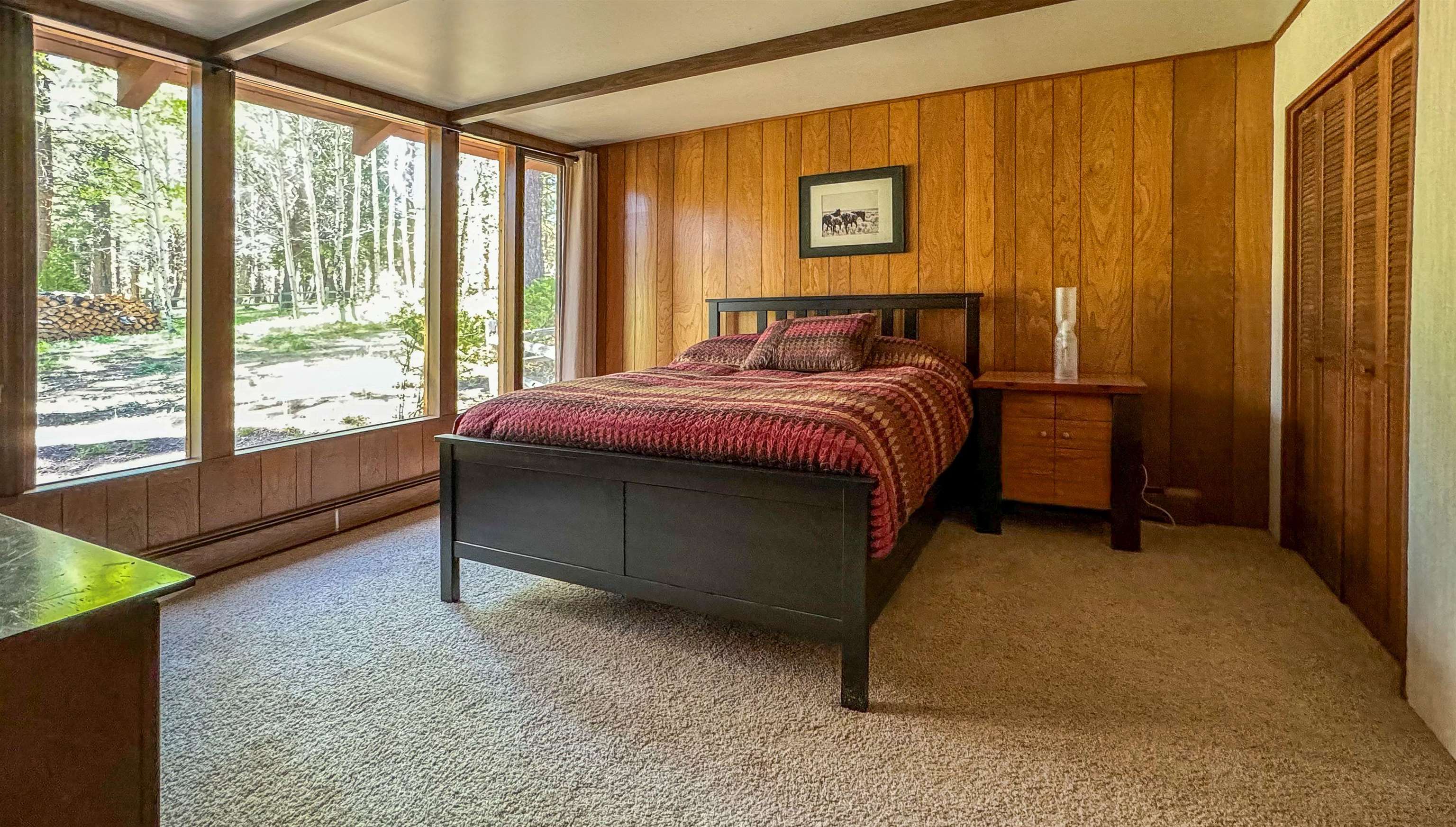 300 Meadow Ranch Road Calpine, CA 96124 - Photo 13 of 21 a spacious bedroom with a bed and a window