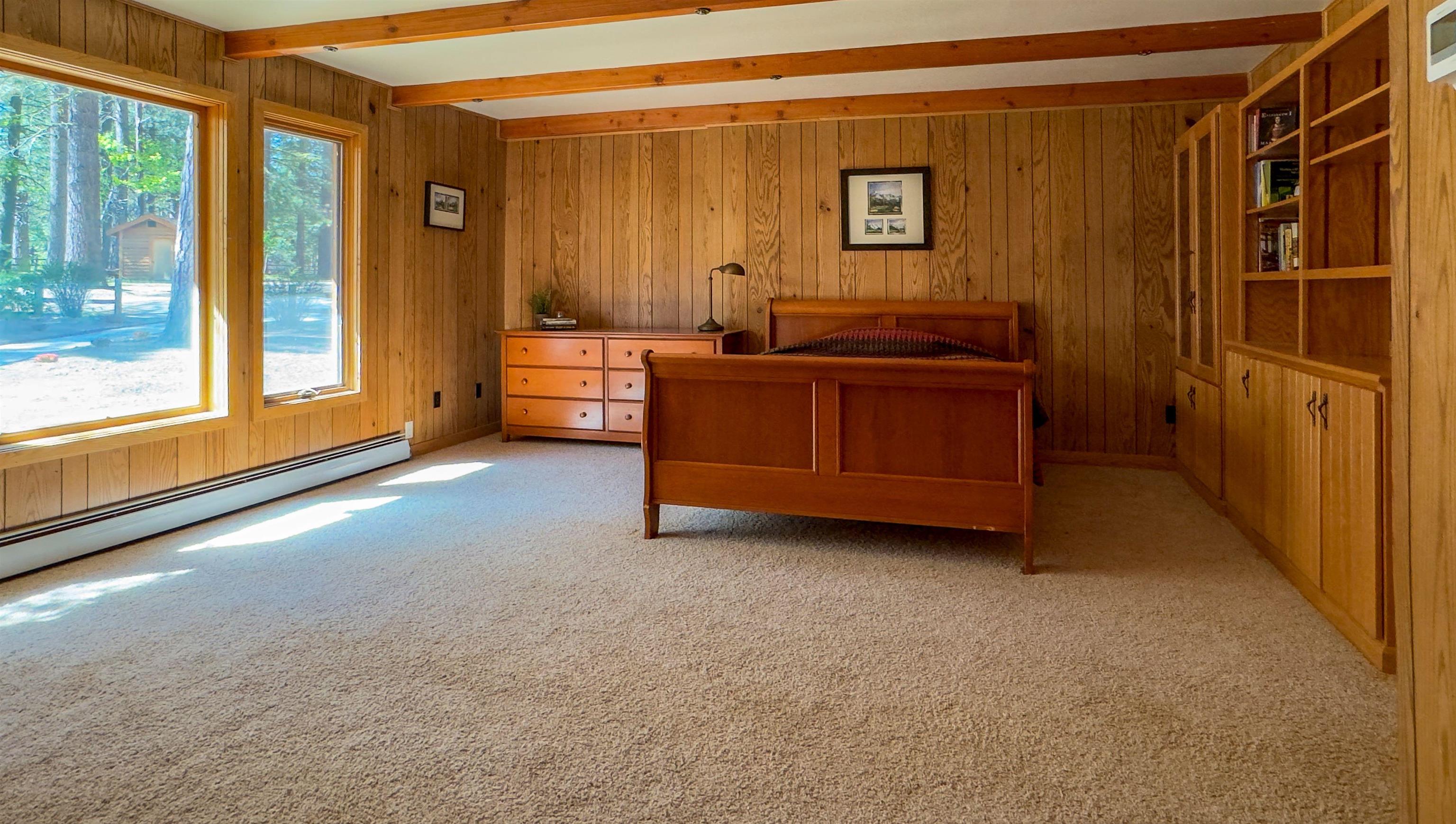 300 Meadow Ranch Road Calpine, CA 96124 - Photo 14 of 21 a room that has a bed and a window