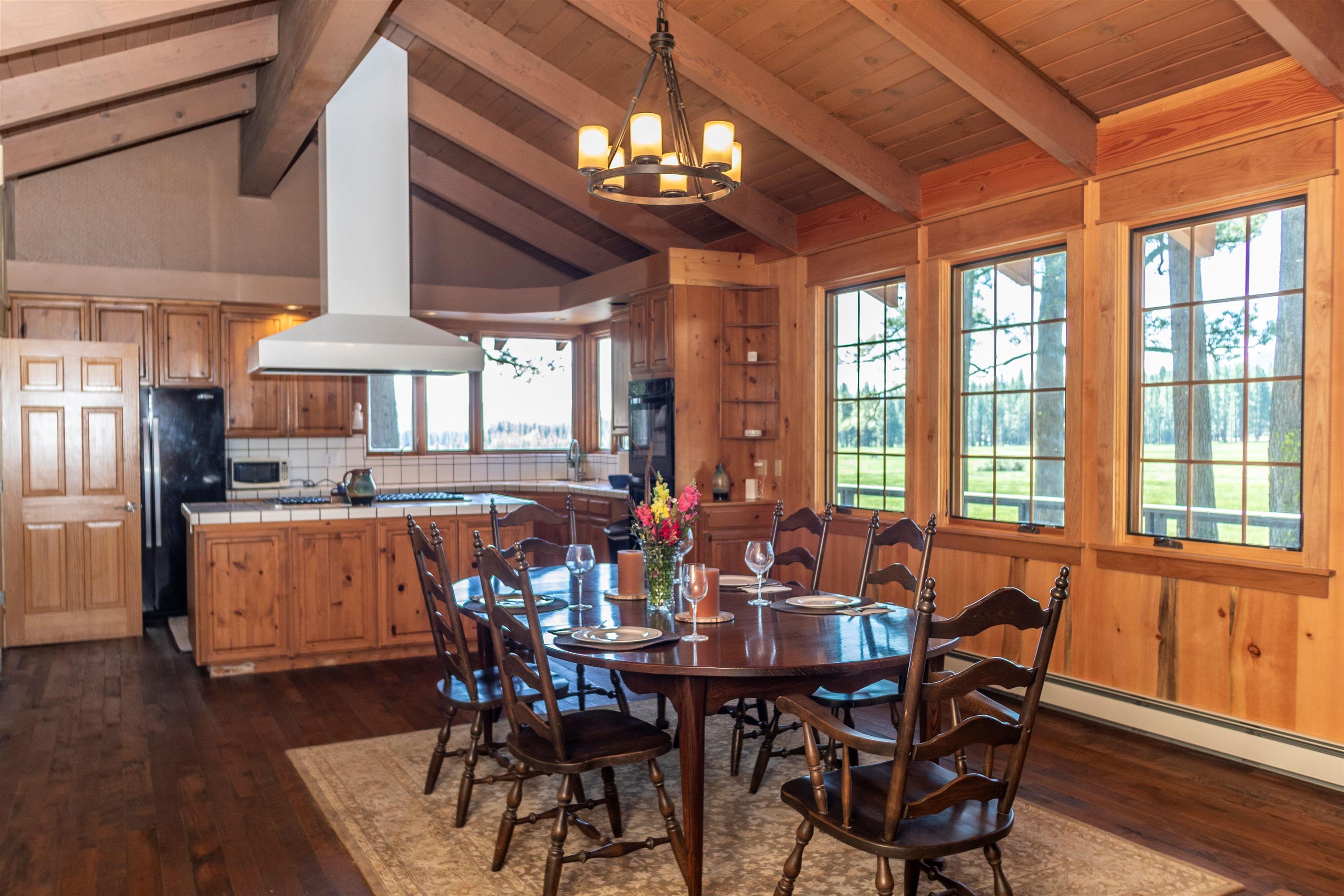 300 Meadow Ranch Road Calpine, CA 96124 - Photo 18 of 21 a view of a dining room with furniture window and wooden floor