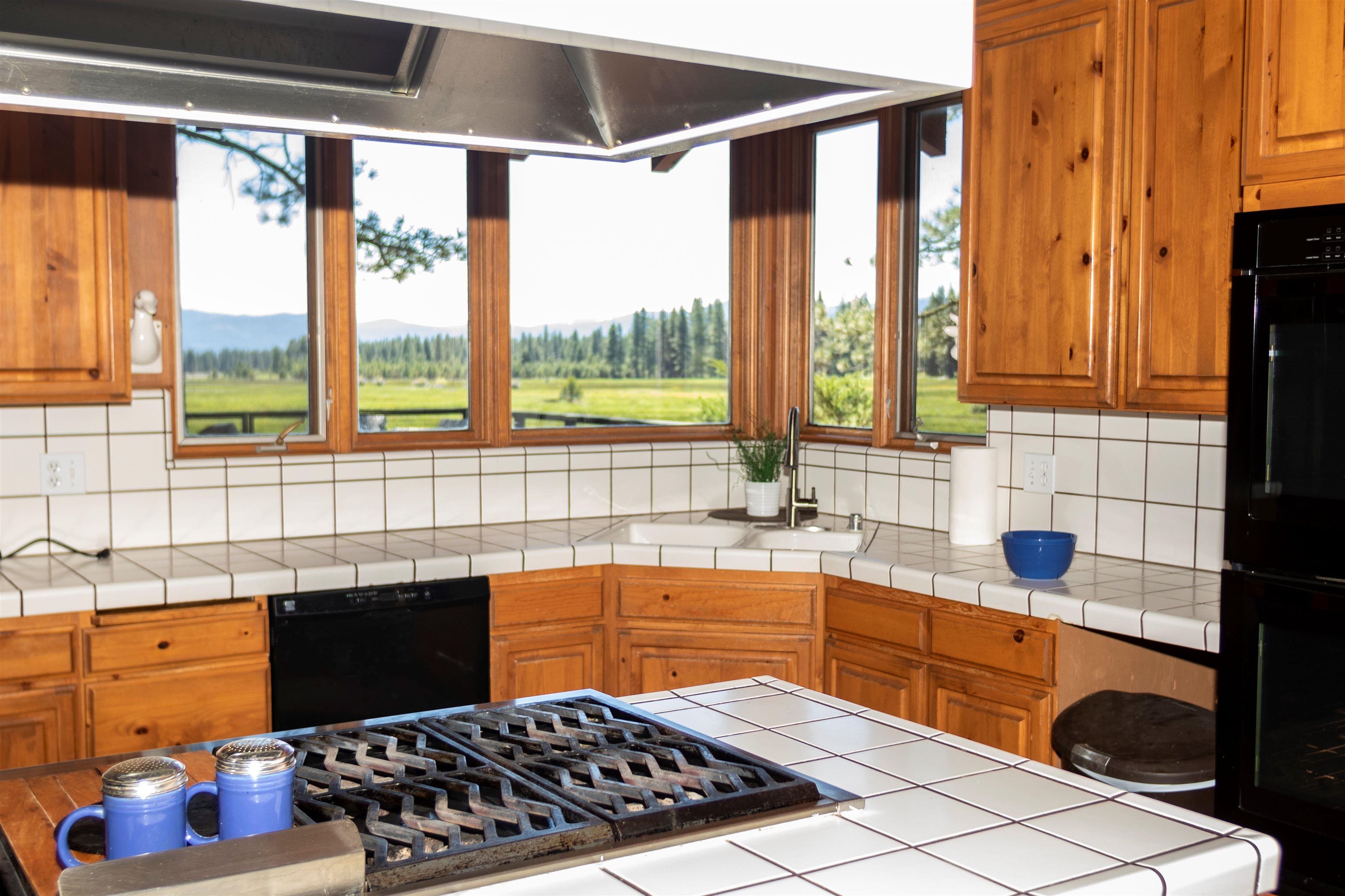 300 Meadow Ranch Road Calpine, CA 96124 - Photo 21 of 21 a kitchen with a sink stove and cabinets