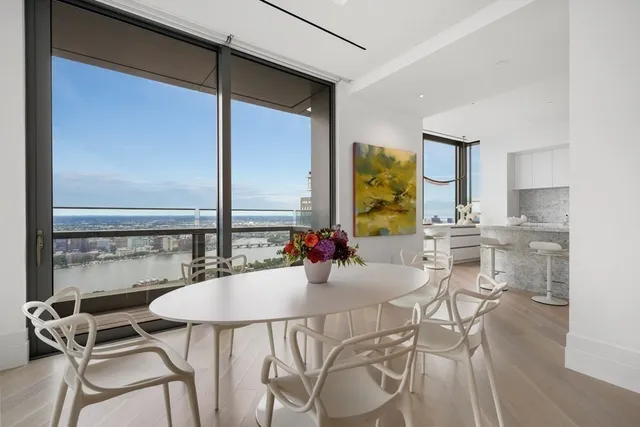 a view of a dining room with furniture and window