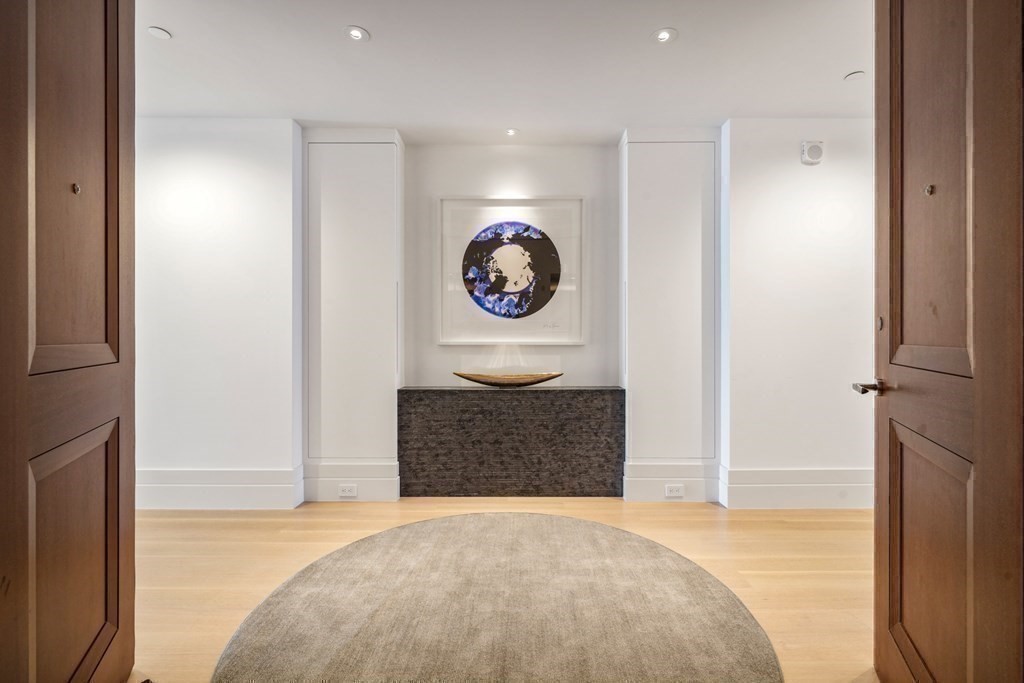 1 Dalton Street, Unit 5801/5802 Boston, MA 02115 - Photo 23 of 28 a bedroom with a bed and a painting on the wall