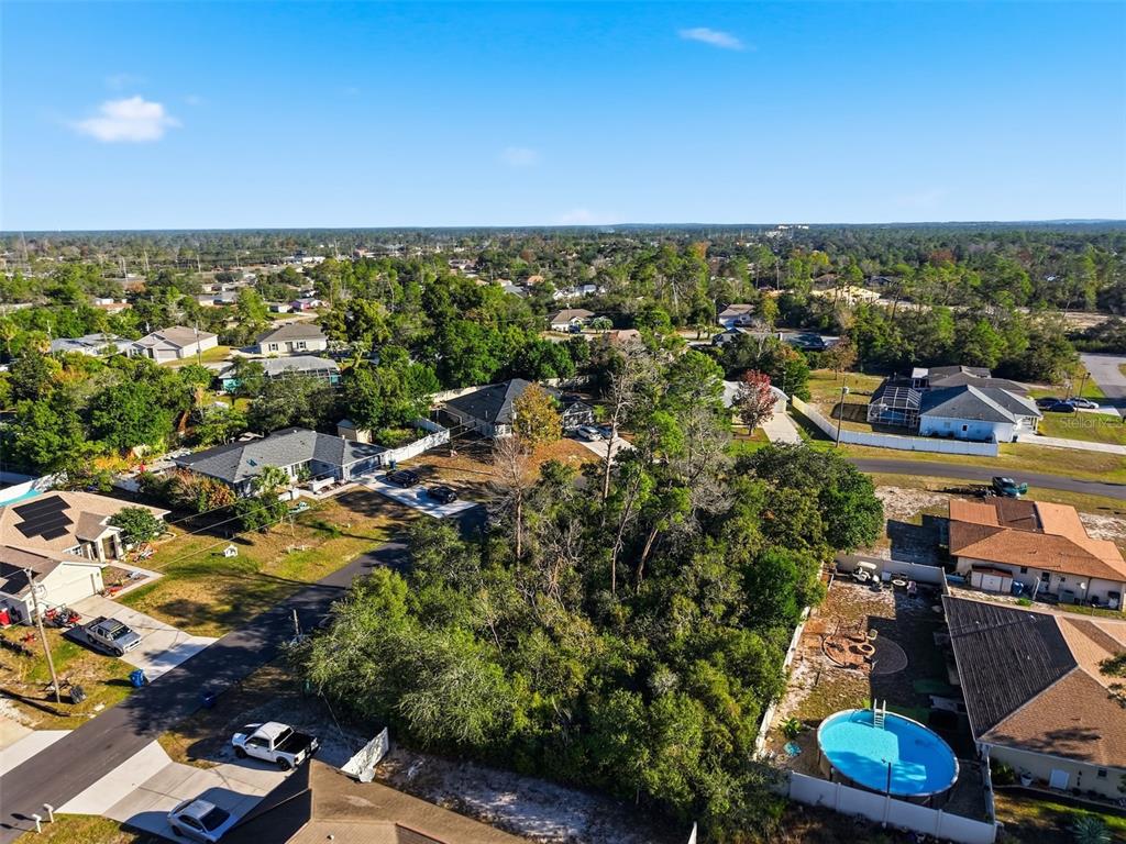0 Montebello Lane Spring Hill, FL 34608 - Photo 5 of 8 an aerial view of residential houses with outdoor space