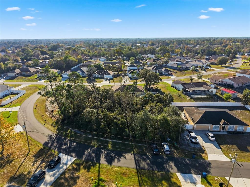 0 Montebello Lane Spring Hill, FL 34608 - Photo 8 of 8 a view of a city with lawn chairs