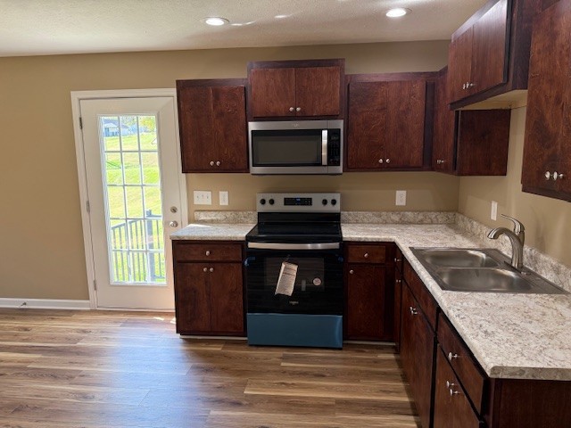 206 Hotel Street Decherd, TN 37324 - Photo 29 of 30 a kitchen with granite countertop wooden cabinets and a granite counter tops