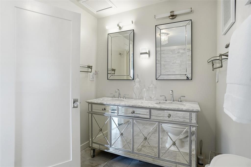 9501 Confederate Park Road Lakeside, TX 76135 - Photo 11 of 33 a bathroom with a granite countertop sink a toilet and a mirror