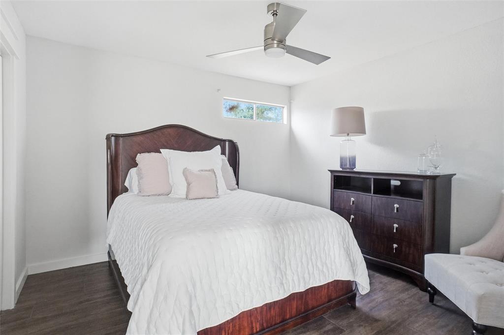 9501 Confederate Park Road Lakeside, TX 76135 - Photo 19 of 33 a bedroom with a bed and wooden floor