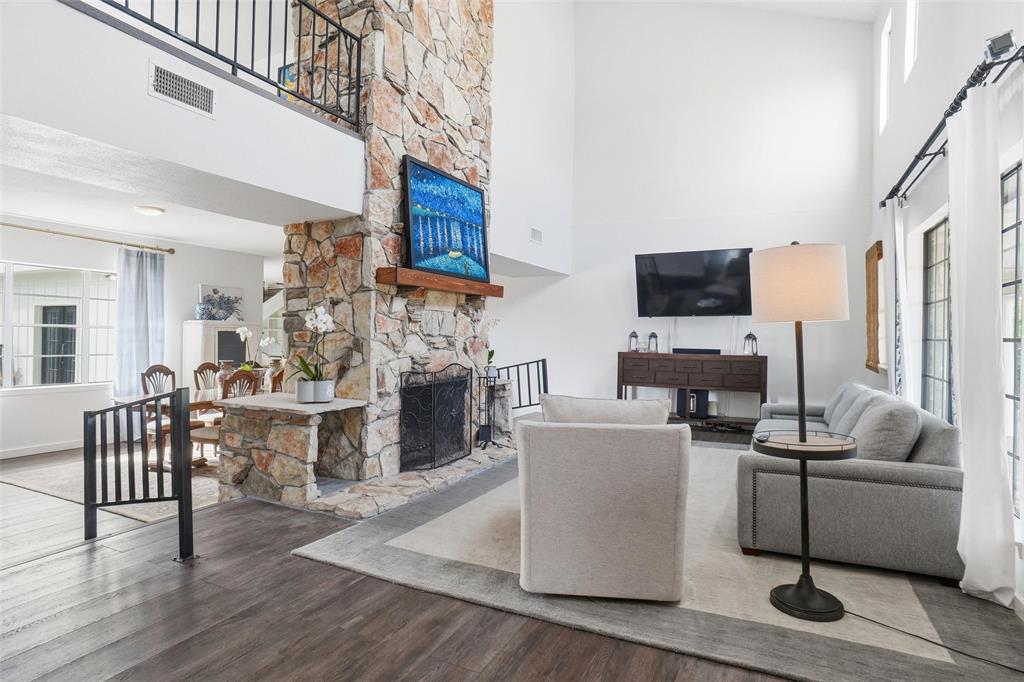 9501 Confederate Park Road Lakeside, TX 76135 - Photo 3 of 33 a living room with furniture a fireplace and a flat screen tv