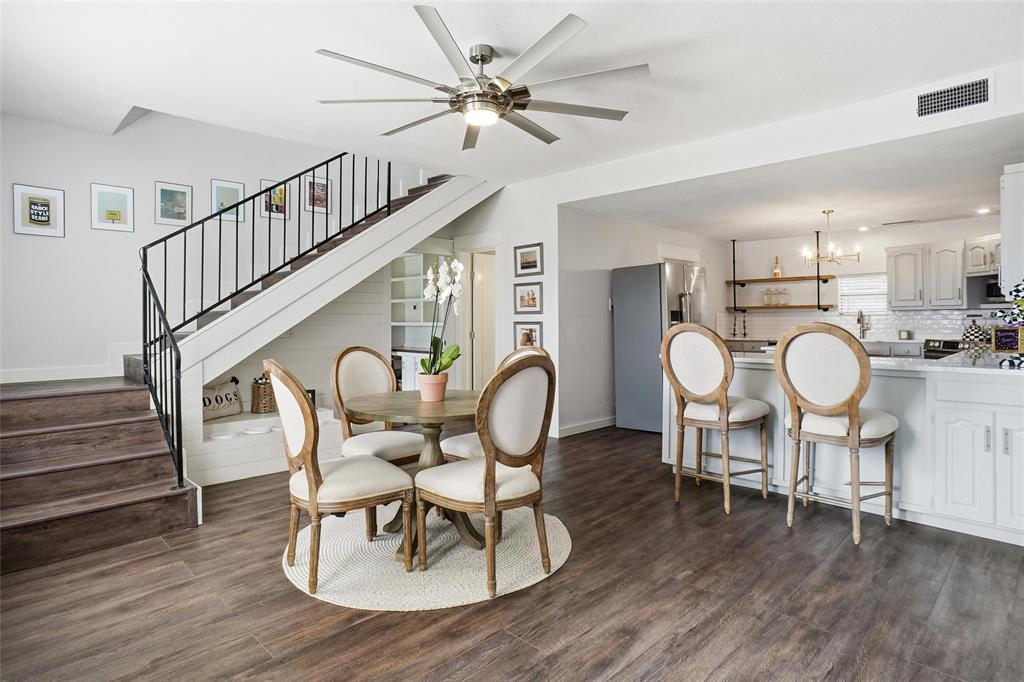 9501 Confederate Park Road Lakeside, TX 76135 - Photo 6 of 33 a dining room with furniture a chandelier and wooden floor