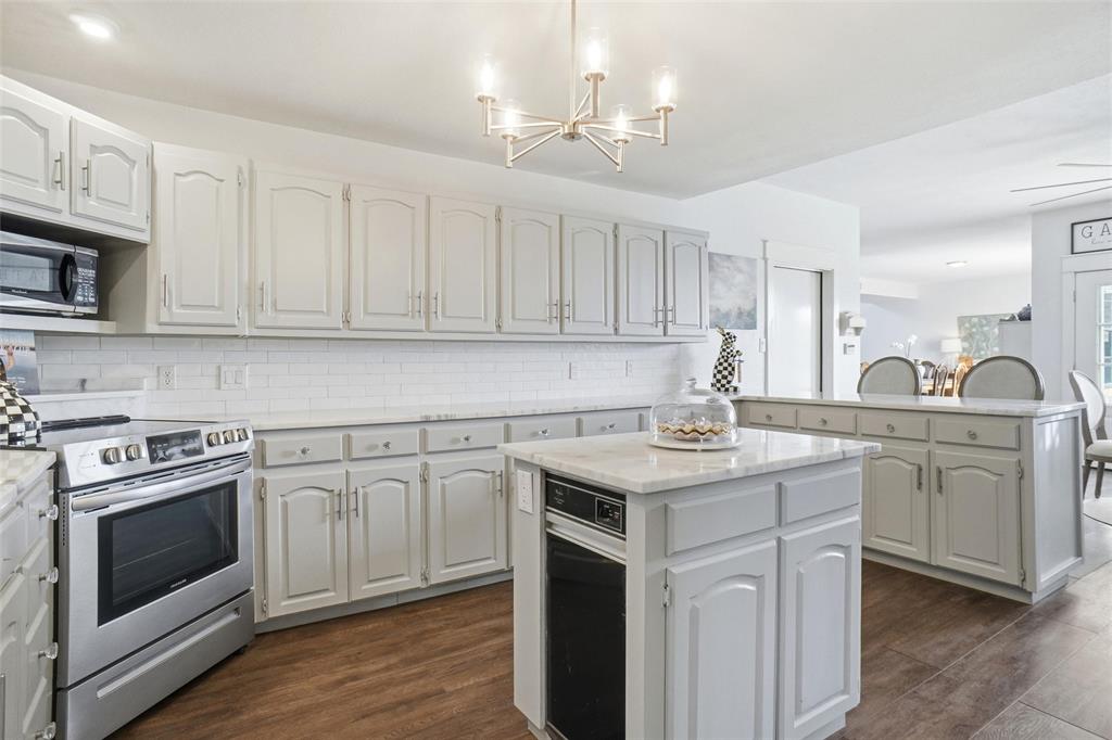 9501 Confederate Park Road Lakeside, TX 76135 - Photo 8 of 33 a kitchen with white cabinets stainless steel appliances and sink