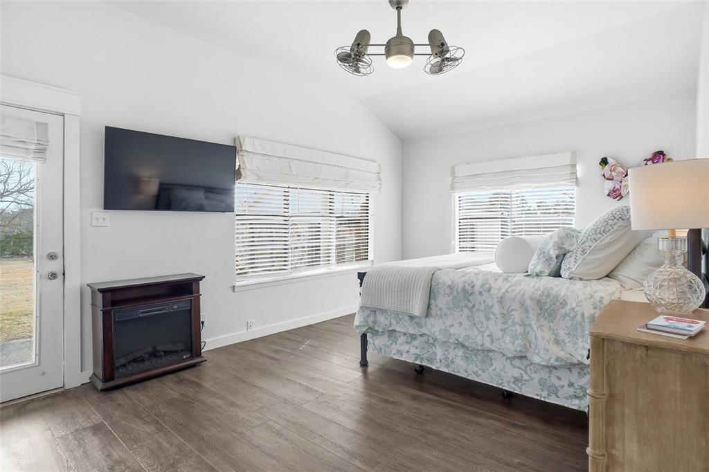 9501 Confederate Park Road Lakeside, TX 76135 - Photo 10 of 33 a bedroom with a bed and a flat screen tv