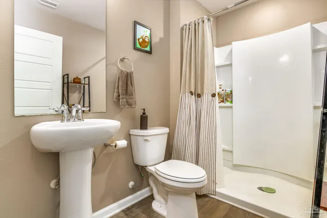 a bedroom with a bed and a cabinet