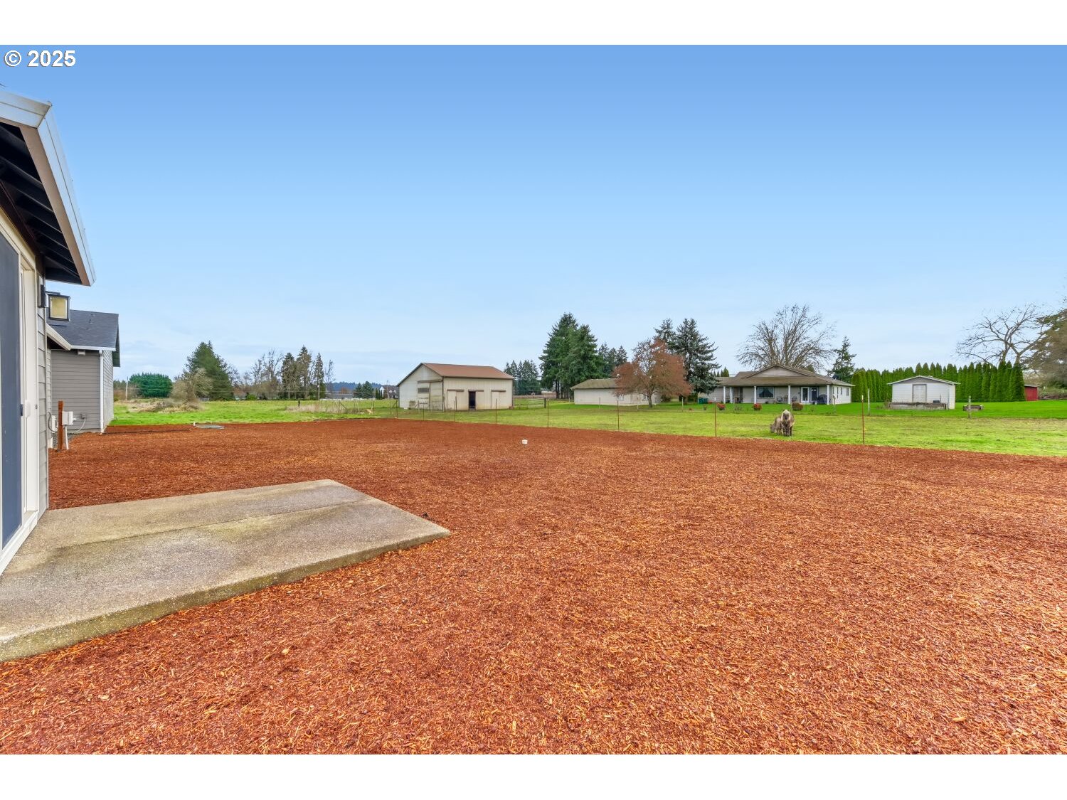 1561 Southwest Stringtown Road Forest Grove, OR 97116 - Photo 33 of 48 a view of a yard and front of a building