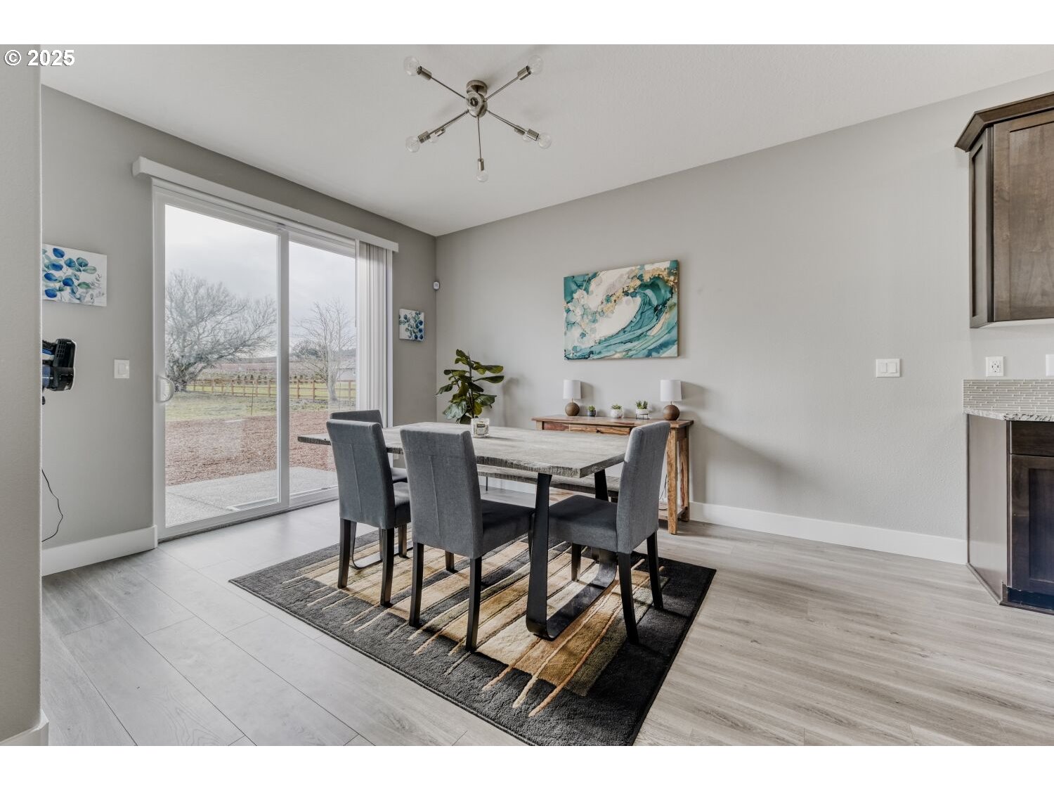 1561 Southwest Stringtown Road Forest Grove, OR 97116 - Photo 9 of 48 a view of a dining room with furniture window and wooden floor
