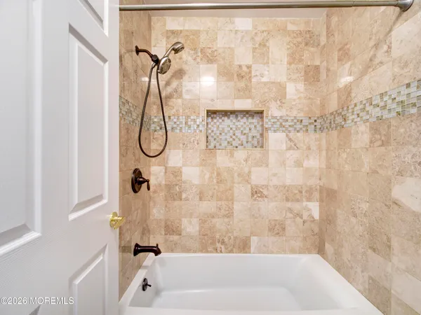 a bathroom with a bath tub