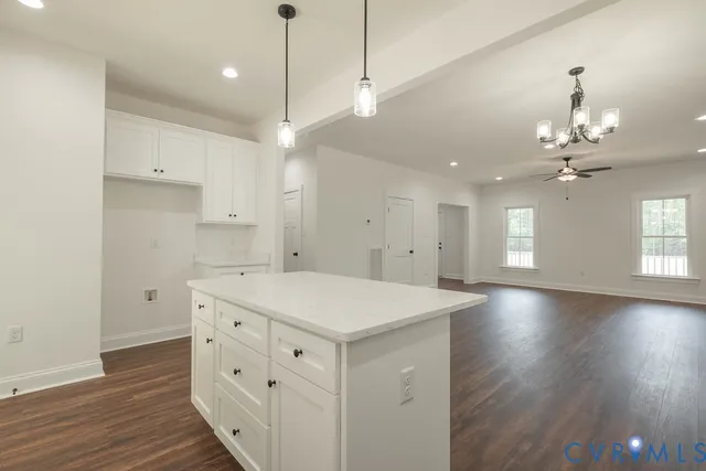a kitchen that has a lot of cabinets in it