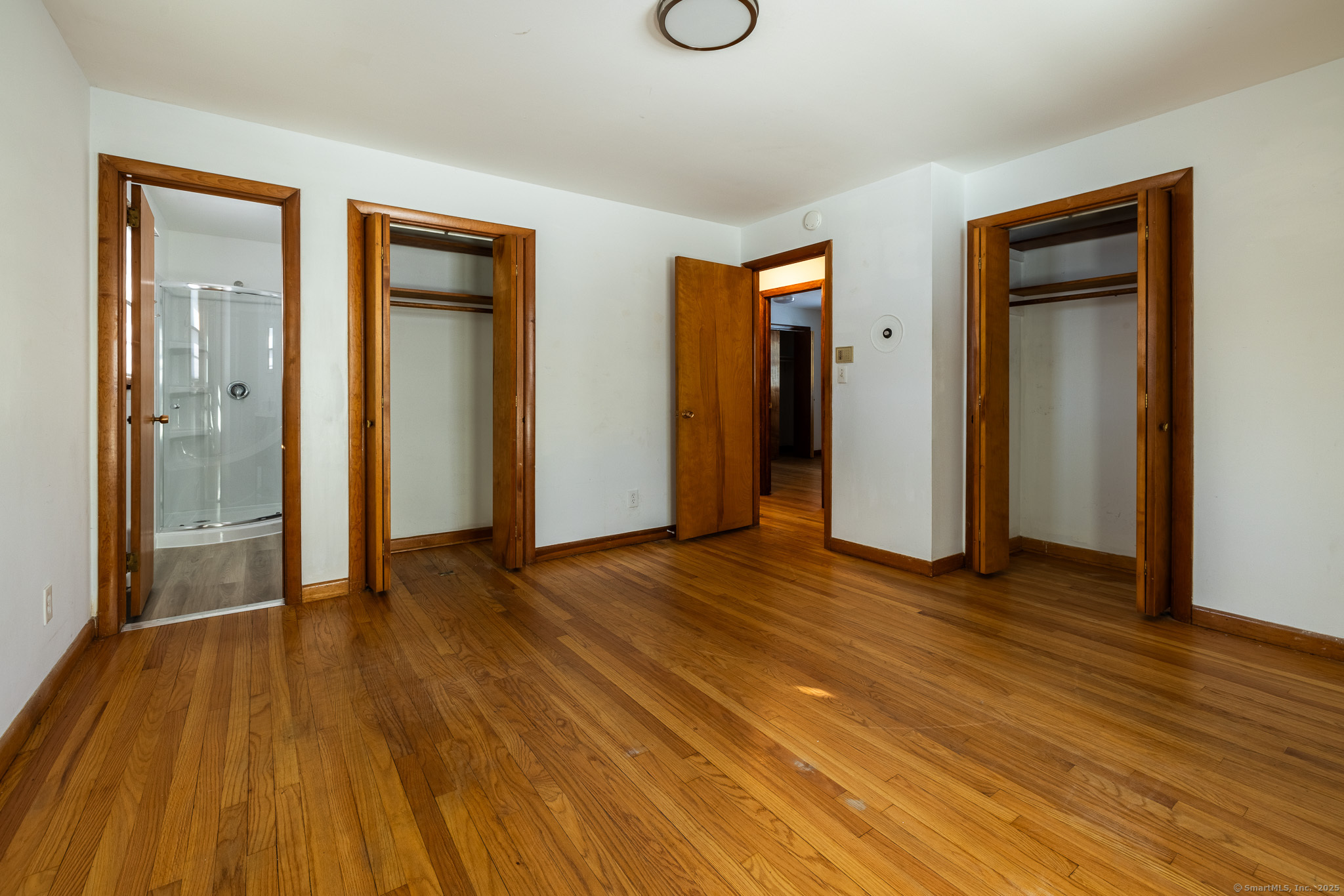 3845 Old Town Road Bridgeport, CT 06606 - Photo 17 of 27 a view of empty room with wooden floor and closet