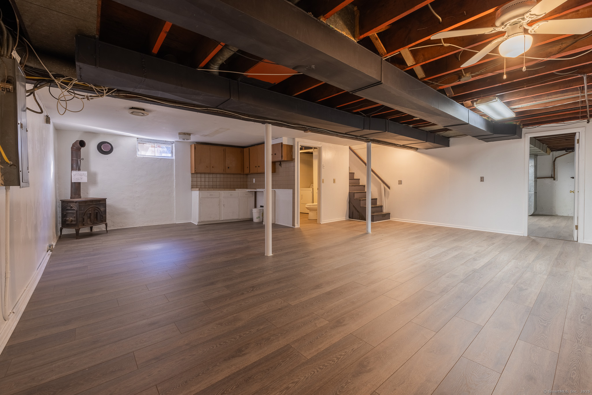 3845 Old Town Road Bridgeport, CT 06606 - Photo 22 of 27 a view of empty room with wooden floor