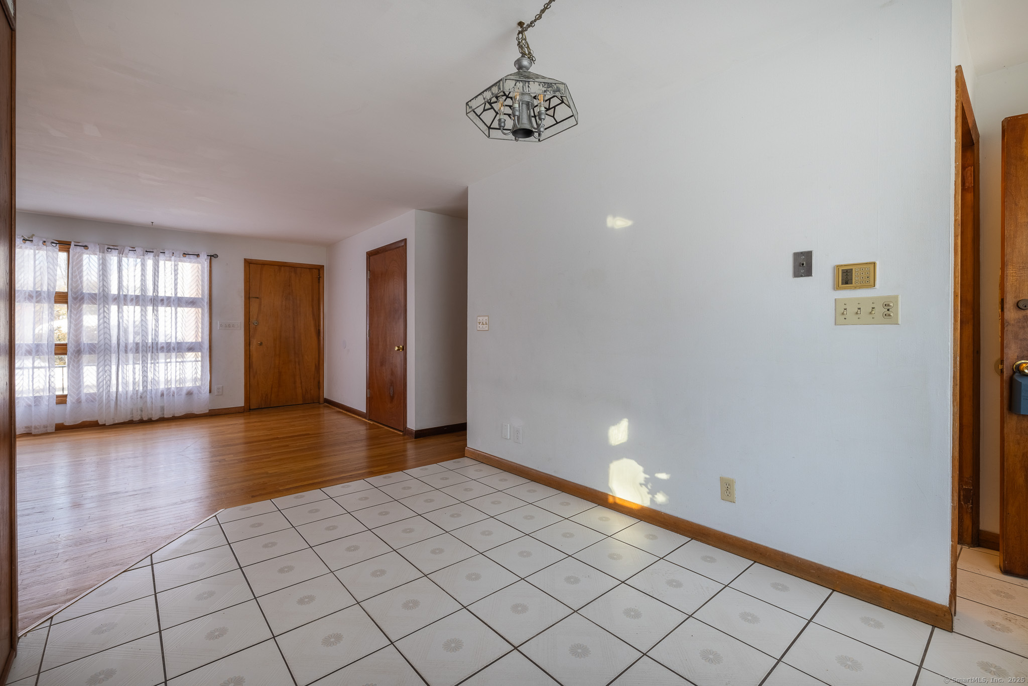 3845 Old Town Road Bridgeport, CT 06606 - Photo 9 of 27 a view of an empty room and window