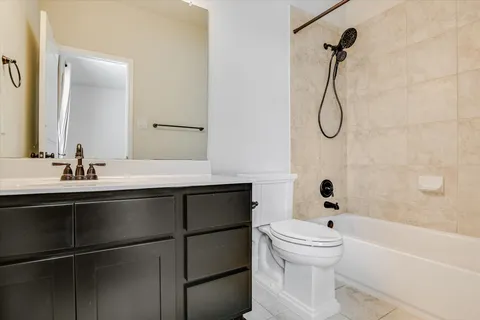 a bathroom with a sink a toilet and a bathtub