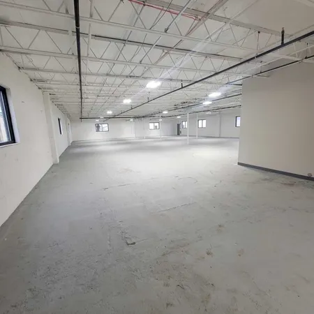 a white toilet sitting next to a white sink