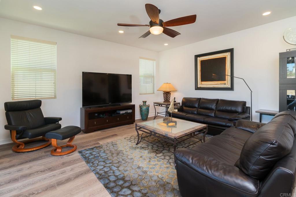 9056 Hightail Drive Santee, CA 92071 - Photo 20 of 73 a living room with furniture and a flat screen tv