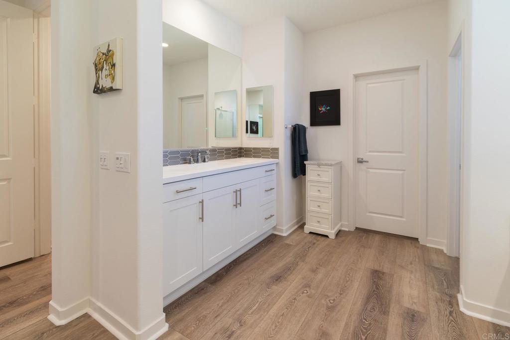 9056 Hightail Drive Santee, CA 92071 - Photo 25 of 73 a view of a kitchen with wooden floor and electronic appliances