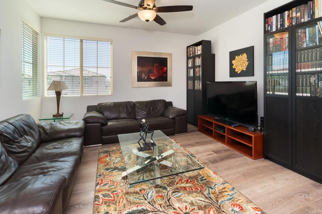 9056 Hightail Drive Santee, CA 92071 - Photo 28 of 73 a living room with furniture and a flat screen tv