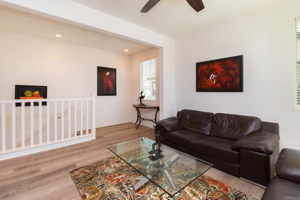 9056 Hightail Drive Santee, CA 92071 - Photo 29 of 73 a living room with furniture and a wooden floor