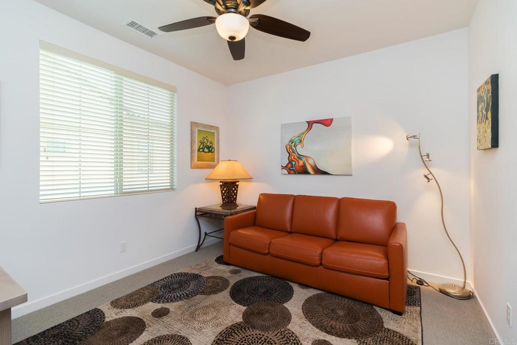 9056 Hightail Drive Santee, CA 92071 - Photo 30 of 73 a living room with furniture and a window
