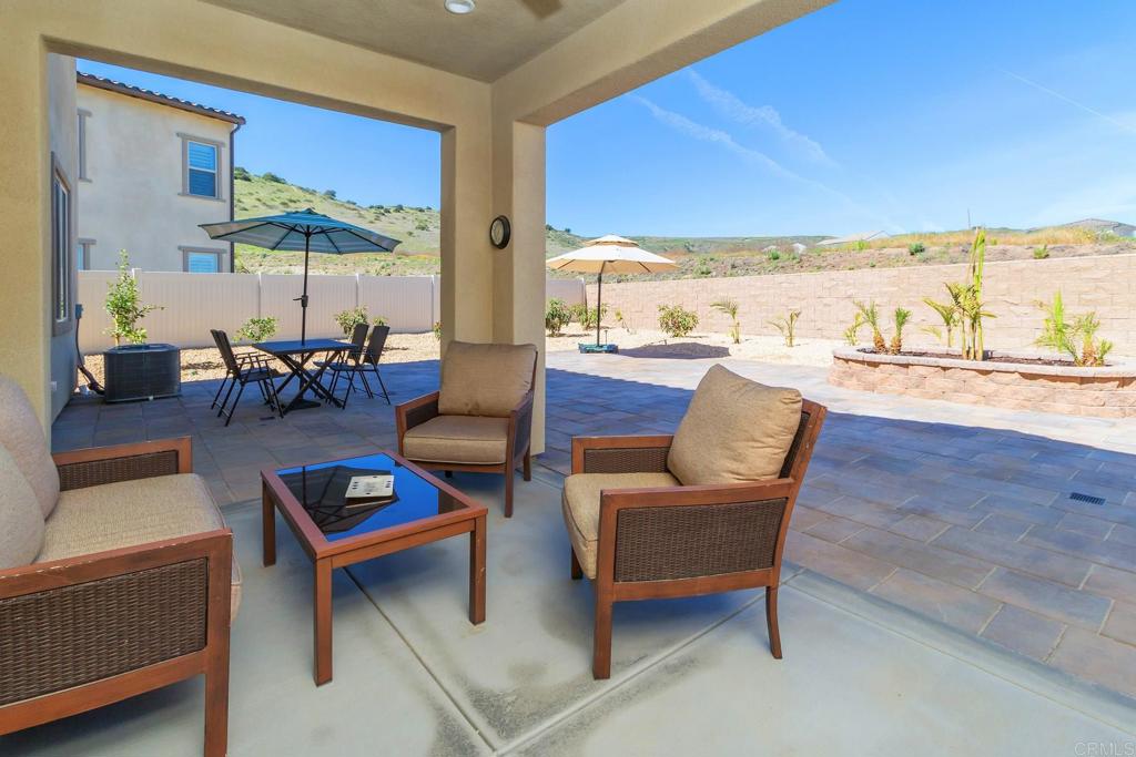 9056 Hightail Drive Santee, CA 92071 - Photo 3 of 73 a living room with furniture and a large window