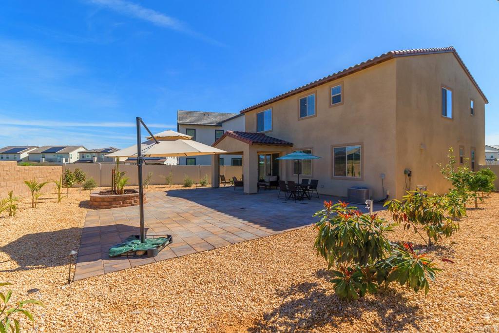 9056 Hightail Drive Santee, CA 92071 - Photo 37 of 73 a front view of a house with a yard