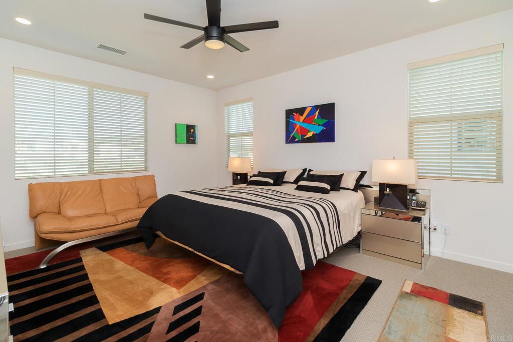 9056 Hightail Drive Santee, CA 92071 - Photo 4 of 73 a bedroom with a bed and wooden floor