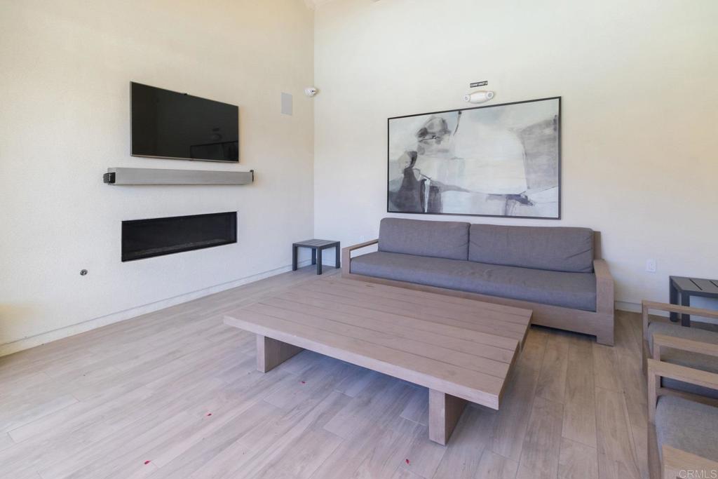 9056 Hightail Drive Santee, CA 92071 - Photo 46 of 73 a living room with furniture and a flat screen tv
