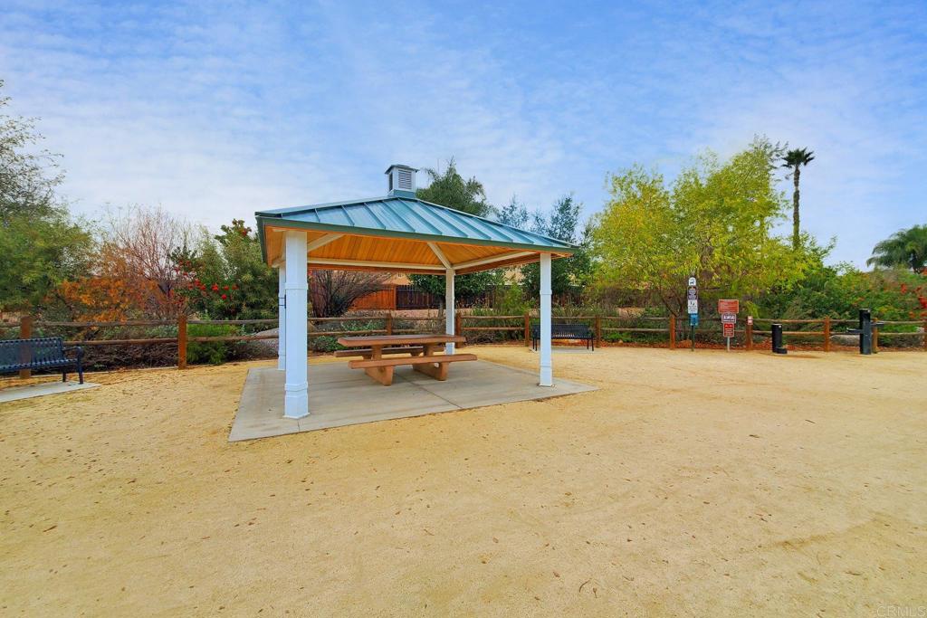 9056 Hightail Drive Santee, CA 92071 - Photo 67 of 73 a view of a house with backyard porch and sitting area