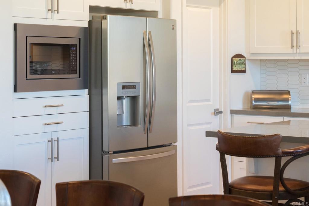 9056 Hightail Drive Santee, CA 92071 - Photo 9 of 73 a close view of a kitchen with appliances and cabinets