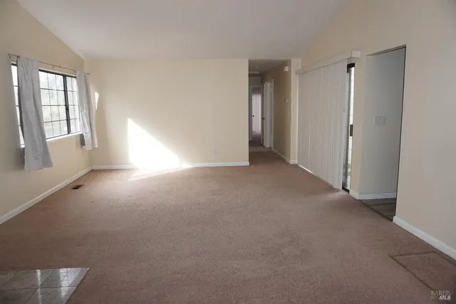 a view of empty room with windows