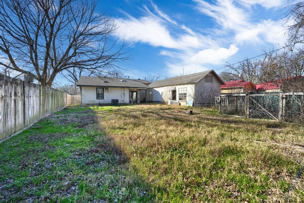 2112 Mangum Street Commerce, TX 75428 - Photo 19 of 19 a front view of a house with a yard