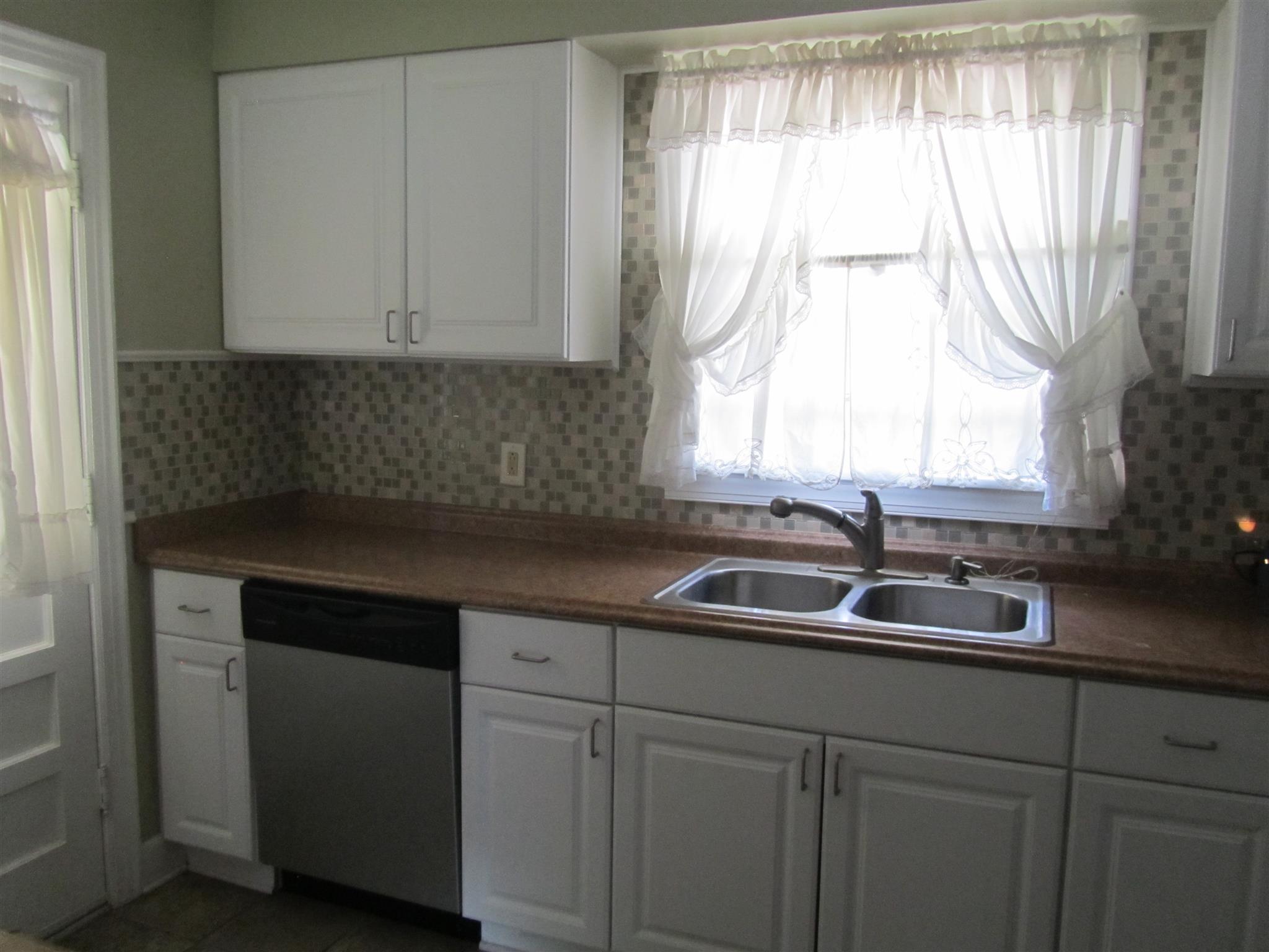 1508 5th Avenue West Springfield, TN 37172 - Photo 8 of 12 Kitchen with upgraded dishwasher and stove