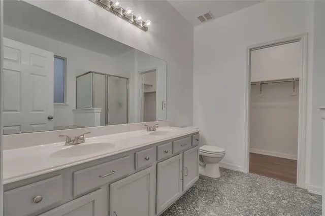 a bathroom with a bathtub and shower