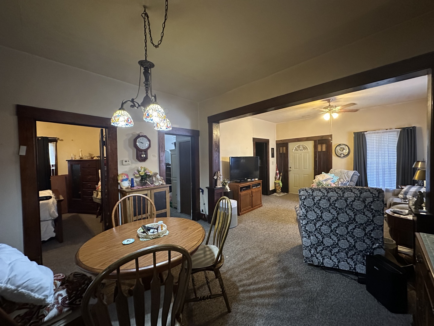 410 South Walnut Street Sesser, IL 62884 - Photo 12 of 22 a dining room with furniture a chandelier and window