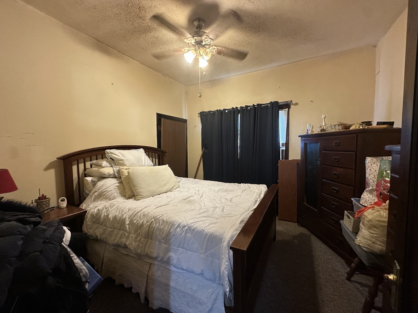 410 South Walnut Street Sesser, IL 62884 - Photo 14 of 22 a bedroom with a bed and a chandelier