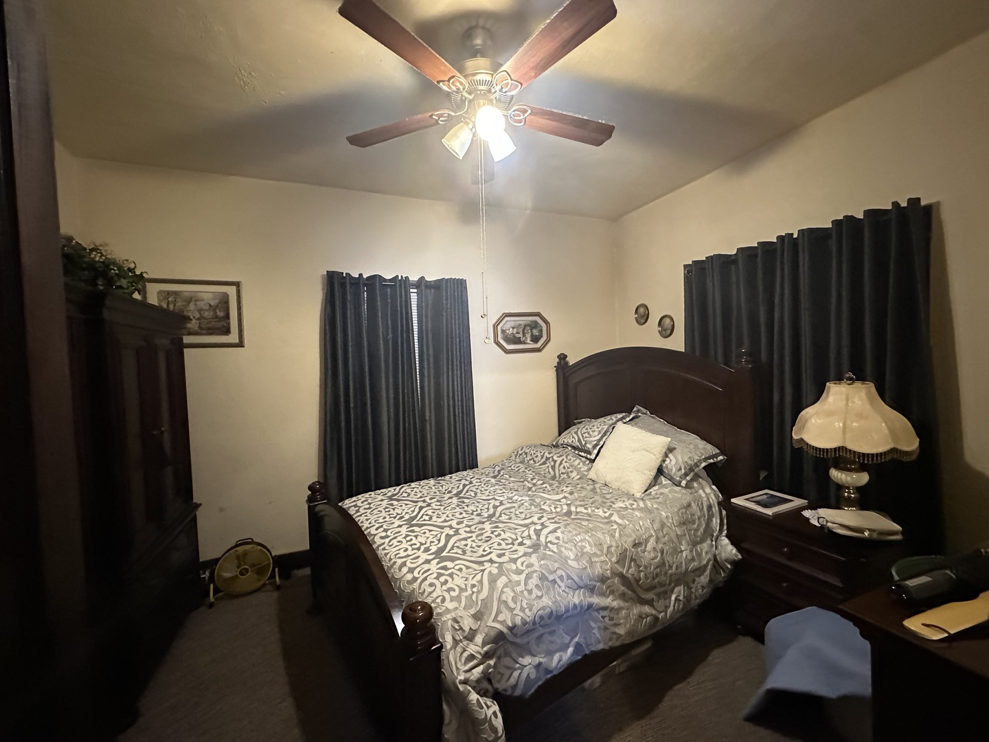 410 South Walnut Street Sesser, IL 62884 - Photo 15 of 22 a bedroom with a bed and a chandelier