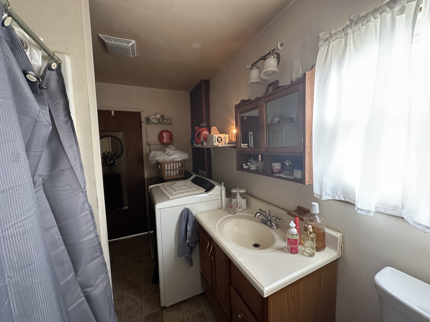 410 South Walnut Street Sesser, IL 62884 - Photo 21 of 22 a bathroom with a sink vanity mirror and toilet